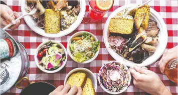  ?? — LEILA KWOK ?? Railtown Cafe is offering heat-and-serve meals inspired by southern BBQ with pulled pork, coleslaw and cornbread.