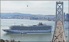  ?? JOSE CARLOS FAJARDO/BAY AREA NEWS GROUP ?? The Grand Princess cruise ship, which has coronaviru­s positive passengers, passes the western span of the San Francisco-Oakland Bay Bridge on Yerba Buena Island in San Francisco on Monday.