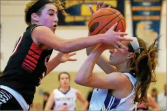  ?? BOB RAINES — DIGITAL FIRST MEDIA ?? Carroll’s Isabella Tournament. Sorrentino fouls Mount St. Joe’s Grace DiGiovanni Saturday in the PIAA