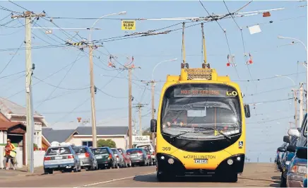  ??  ?? Tangled web: Wellington’s trolley buses are being replaced by hybrids as a transition to a fully battery-electric fleet when that technology has matured.