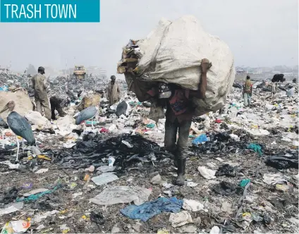  ?? Picture: Reuters ?? A scavenger carries recyclable plastic materials packed in a sack at the Dandora dumping site on the outskirts of Nairobi, Kenya, recently.