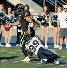  ?? DAVE SANDFORD/GET TY IMAGES ?? Zach Collaros of the Hamilton Tiger-Cats is sacked by Greg Romeus of Toronto during the Argos’ 41-23 win, Thursday.