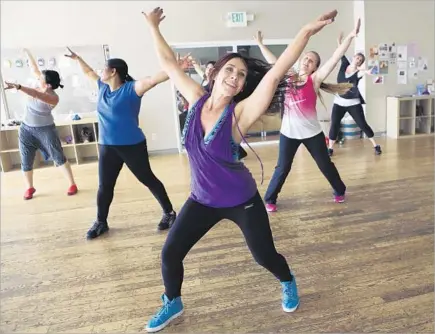  ?? Photograph­s by Mel Melcon
Los Angeles Times ?? INSTRUCTOR SHAWNEE RIOLES, foreground, leads a Zumba toning class at the Heartbeat House in Atwater Village.