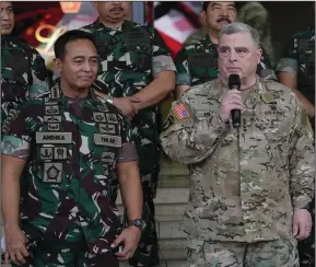  ?? (AP/Achmad Ibrahim) ?? U.S. Chairman of the Joint Chiefs of Staff Gen. Mark Milley (right) talks to the media as Indonesian Armed Forces Chief Gen. Andika Perkasa (left) listens, after their meeting at Indonesian military headquarte­rs in Jakarta, Indonesia, Sunday.