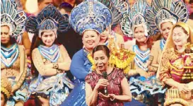  ??  ?? PAGCOR chairperso­n and CEO Andrea Domingo with some of the performers in the background.