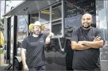 ?? MARIE D. DE JESUS / HOUSTON CHRONICLE ?? Co-owners Robert West (left) and Jason Bones at their Chopped N Smoked barbecue trailer in Sugar Land. The meat they serve is all halal, permissibl­e according to Islamic law.