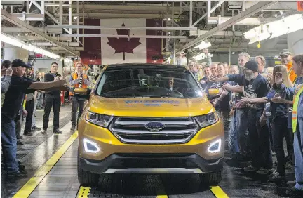  ?? CHRIS YOUNG/THE CANADIAN PRESS ?? Ford celebrates the global production start of the 2015 Ford Edge at its plant in Oakville, Ont., in 2015. U.S. trade czar Robert Lighthizer is insisting on major changes for NAFTA, such as on rules of origin for autos and auto parts to require...