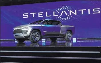  ?? John Locker The Associated Press ?? The Ram 1500 Revolution electric battery-powered pickup is displayed Jan. 5 during the Stellantis keynote at the CES tech show in Las Vegas.