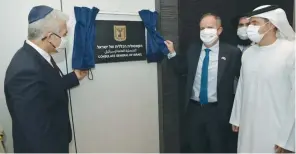  ??  ?? FOREIGN MINISTER Yair Lapid unveils the plaque outside the consulate in Dubai yesterday. (Foreign Ministry)