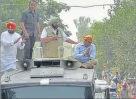  ?? GURPREET SINGH/HT ?? CM Capt Amarinder Singh during a roadshow in support of Congress candidate Sandeep Sandhu (right) in the Dakha segment on Thursday. Ludhiana MP Ravneet Singh Bittu is also seen.