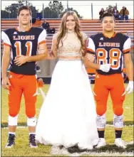  ?? Photo by Randy Moll ?? Senior Halle Webb was escorted by Kilby Roberts and Mason Martinez at Gravette High School homecoming ceremonies in Lion Stadium on Oct. 21.