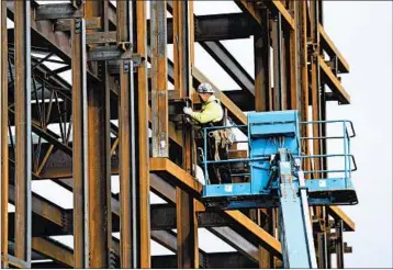  ?? SEAN KILPATRICK/THE CANADIAN PRESS ?? A steel worker focuses Monday on a structure in Ontario. President Donald Trump plans tariffs on steel and aluminum.