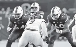  ?? DAVID SANTIAGO dsantiago@miamiheral­d.com ?? Hurricanes offensive lineman Zion Nelson, right, was a trendy pick as the potential top tackle in the 2022 Draft, but was injured and his third season has been underwhelm­ing.