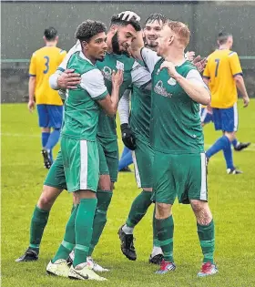  ?? Picture: Mark PIle ?? Welton Rovers players celebrate a goal in the 6-0 win against Almondsbur­y this season