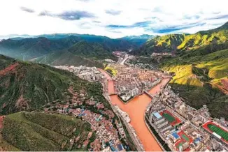  ?? PHOTOS PROVIDED TO CHINA DAILY ?? The Zachu and Ngomchu rivers converge at Chamdo city which is now known as “the pearl of eastern Tibet”.