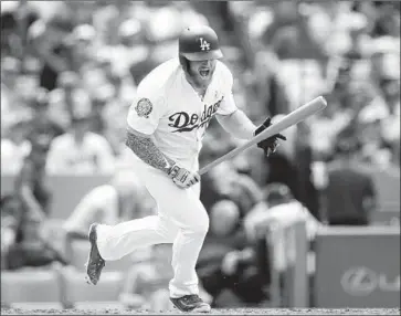  ?? Allen J. Schaben Los Angeles Times ?? MAX MUNCY of the Dodgers is frustrated after flying out to San Francisco center fielder Andrew McCutchen in the sixth inning. The first baseman was hitless in three at-bats in the Dodgers’ 4-1 loss.