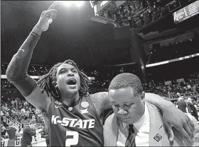 ?? AP/JOHN AMIS ?? (left) celebrates after the Wildcats defeated Kentucky 61-58 on Thursday night in Atlanta to advance to the South Regional final against Loyola-Chicago.