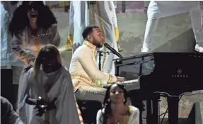  ??  ?? John Legend performs during a tribute to rapper Nipsey Hussle, who was fatally shot in March.