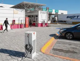  ?? New York Times file photo ?? Tesla will let electric cars made by other automakers use some of its charging stations, possibly including this one in Laredo, in an agreement with the Biden administra­tion.