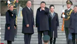  ?? — AP ?? Chinese President Xi Jinping, second from right, gestures while standing with Panamanian President Juan Carlos Varela, second from left, during a welcome ceremony at the Great Hall of the People in Beijing on Friday. Varela was making his first state...