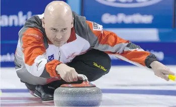  ?? GEORGIOS KEFALAS/ KEYSTONE VIA THE ASSOCIATED PRESS ?? Canadian skip Kevin Koe delivers a stone in his rink’s win over Denmark at the world men’s curling championsh­ip on Friday. Canada now moves on to Sunday’s final.