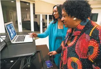  ?? SANDY HUFFAKER ?? Dr. Akilah Weber watches election results Tuesday at her La Mesa home with her mom, Dr. Shirley Weber, whose vacant seat was up for election.