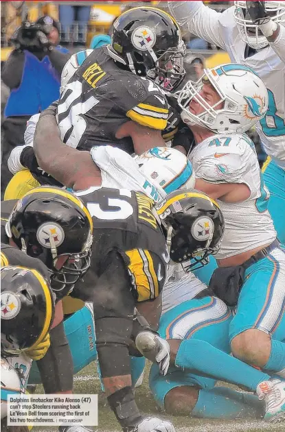  ?? | FREDVUICH/ AP ?? Dolphins linebacker Kiko Alonso ( 47) can’t stop Steelers running back Le’Veon Bell fromscorin­g the first of his two touchdowns.