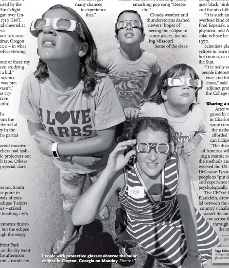  ?? Photo: IC ?? People with protective glasses observe the solar eclipse in Clayton, Georgia on Monday.