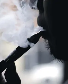  ?? NAM Y. HUH / ASSOCIATED PRESS / CANADIAN PRESS FILES ?? Vaping — with its fruity flavour options — has caught on among this country’s high-schoolers, something Canadian authoritie­s are looking to discourage.