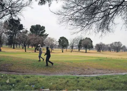  ??  ?? Greener pastures: The Soweto Country Club is hamstrung by a lack of funds, as are black golfing pros such as Sipho Bujela, who gives lessons to bankroll his career.