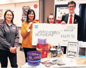  ??  ?? The Co-op donation is handed over to Macclesfie­ld Academy