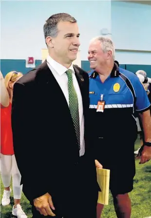  ?? SUSAN STOCKER/SUN SENTINEL ?? Miami Hurricanes new head football coach Mario Cristobal enters the Carol Soffer Indoor Practice Facility Tuesday.