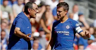  ?? AFP ?? Chelsea coach Maurizio Sarri (left) talks with defender Cesar Azpilicuet­a on the touchline during the Community Shield match against Manchester City. Chelsea lost 2-0. —