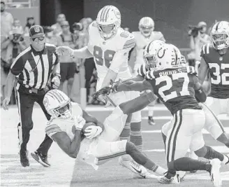  ?? DOUG MURRAY/AP ?? Dolphins receiver DeVante Parker catches a pass for a touchdown against the Colts on Oct. 3.