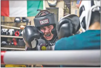  ??  ?? Xavier Cavazos works against Alex Mazzarisi in the ring of the club. Mazzarisi continuall­y coached Cavazos during the spar.