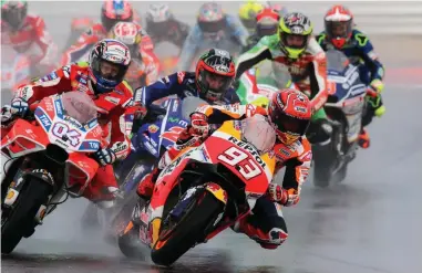  ??  ?? WET WEATHER WINNER: Spanish rider Marc Marquez of Repsol rode a tactical race to win the San Marino Grand Prix yesterday.