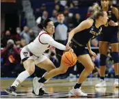  ?? FRANK FRANKLIN II — THE ASSOCIATED PRESS ?? North Carolina State’s Raina Perez, left, steals the ball from Notre Dame’s Dara Mabrey en route to a key basket.