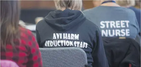  ?? PHOTOS BY ADRIAN LAM, TIMES COLONIST ?? At a small symposium held in city council chambers this month, frontline workers, drug users, their families and advocates gathered to talk about how to respond to the overdose crisis.