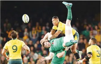  ??  ?? In this file photo taken on June 23, 2018, Ireland’s Peter O’Mahony (centre), and Australian Wallabies’ Israel Folau (top centre), jump for the ball during the third and final Rugby Union Test match between Ireland and Australia inSydney. (AFP)