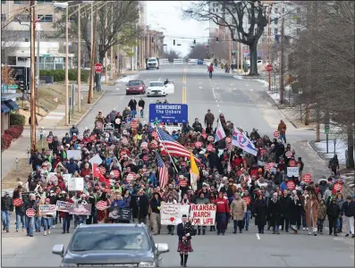  ?? (Arkansas Democrat-Gazette/Colin Murphey) ?? People attending the March for Life event walk down Capitol Ave. towards the Arkansas state Capitol on Sunday.