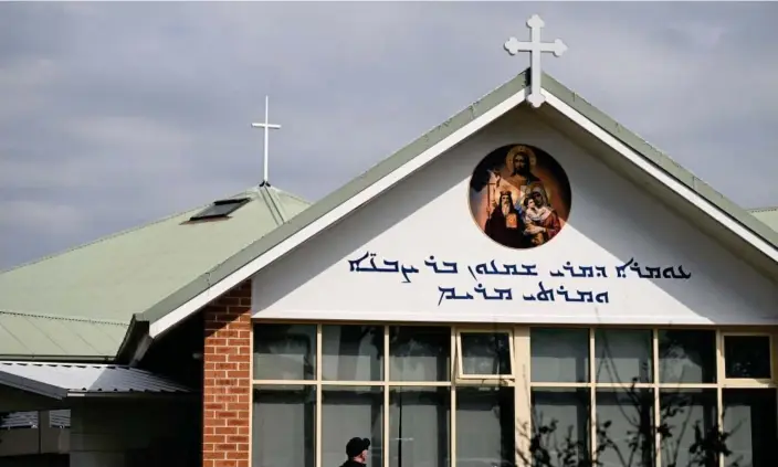  ?? ?? A 16-year-old has been charged with a terrorism offence after an alleged stabbing at the Assyrian Christ the Good Shepherd church in Wakeley. Photograph: Jaimi Joy/Reuters