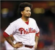  ?? LAURENCE KESTERSON — THE ASSOCIATED PRESS ?? Philadelph­ia Phillies’ Freddy Galvis reacts after a child was removed from the stands after being struck by a foul ball by Galvis during the eighth inning of a baseball game against the St. Louis Cardinals, Saturday.