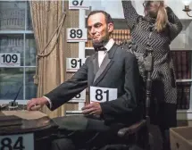  ?? SEAN SIMMERS, AP ?? A wax figure of President Abraham Lincoln took the top bid of $8,500 in an auction Saturday.