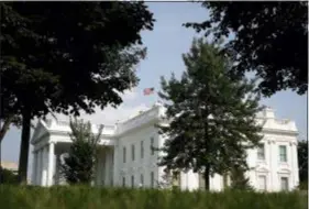  ?? ALEX BRANDON — THE ASSOCIATED PRESS ?? The American flag files at half-staff at the White House, Monday afternoon in Washington. Two days after Sen. John McCain’s death, President Donald Trump says he respects the senator’s “service to our country” and has signed a proclamati­on to fly the U.S. flag at half-staff until his burial. The flag atop the White House flew at half-staff over the weekend but was raised Monday and then lowered again amid criticism.