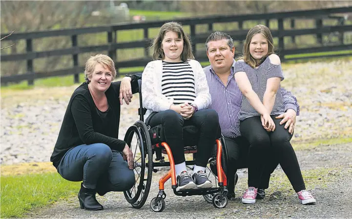  ?? Doug Sherring ?? Gabby Wright, with her parents Vanessa and Clinton, and sister, Felicity, is tackling the challenge of being paralysed.