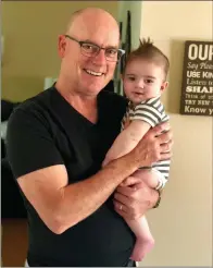  ?? Courtesy photo ?? Bob Larlee holds his grandson Chase Sime. Larlee advocated for the screening that saved his life. They will be walking at the American Heart Associatio­n Walk at Bridgeport Park on Nov. 3 to show their support for the associatio­n.