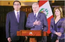  ??  ?? Peruvian President Pedro Pablo Kuczynski, center, accompanie­d by his vice-presidents Martin Vizcarra, left, and Mercedes Araoz, addresses the nation at the Government Palace in Lima on Wednesday. (Reuters)