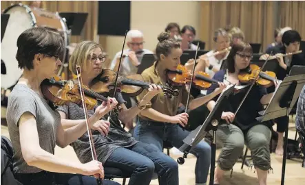  ?? GREG SOUTHAM ?? Former musicians, who gave up music to become dentists, doctors or engineers, get to spend five days with members of the Edmonton Symphony Orchestra at the Rusty Musicians Summer Camp. Participan­ts play with teaching artists and perform orchestral...