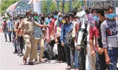  ?? ANI ?? Stranded migrant labourers queue to board a special train to Bihar from MGR Central railway station during the ongoing lockdown in Chennai, Tamil Nadu, yesterday.