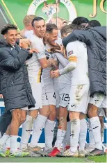  ?? ?? Tom Parkes is mobbed after his winner